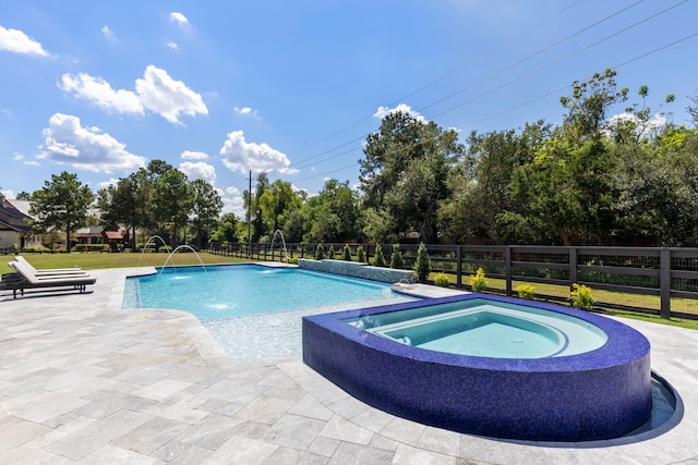 view of pool featuring an in ground hot tub, pool water feature, and a patio