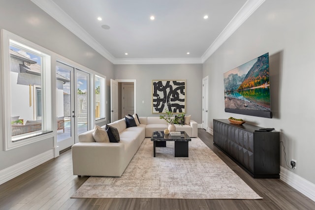 living room featuring crown molding, french doors, and hardwood / wood-style flooring