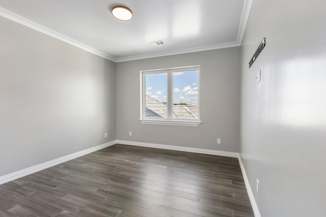 spare room with dark hardwood / wood-style flooring and crown molding