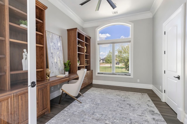 unfurnished office featuring ceiling fan, dark hardwood / wood-style flooring, and crown molding