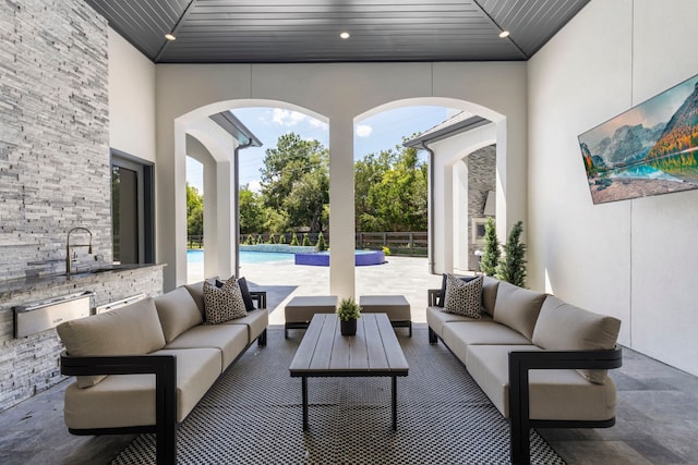 view of patio / terrace featuring outdoor lounge area and sink