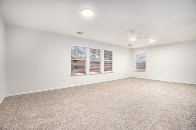 empty room with carpet and ceiling fan