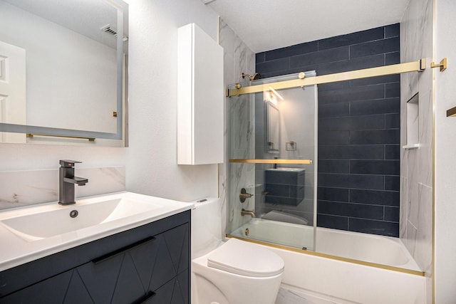 full bathroom with a textured ceiling, vanity, toilet, and enclosed tub / shower combo