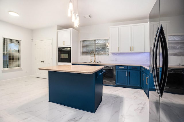 kitchen with black appliances, white cabinets, blue cabinets, sink, and a kitchen island