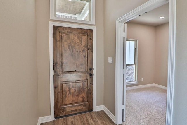 view of carpeted foyer