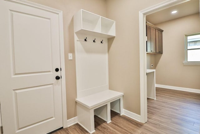 mudroom with light hardwood / wood-style flooring