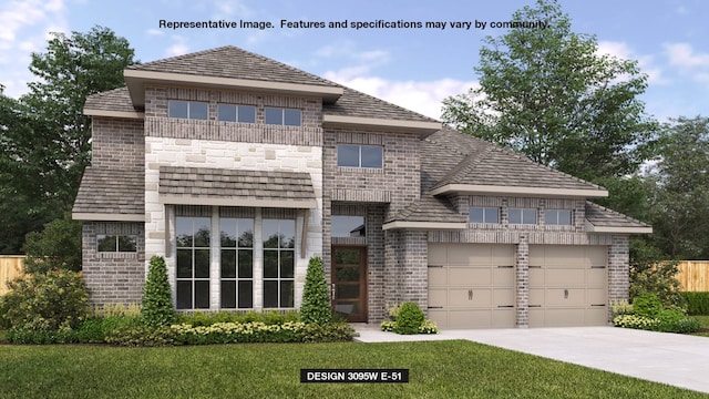 view of front of house with a front lawn and a garage