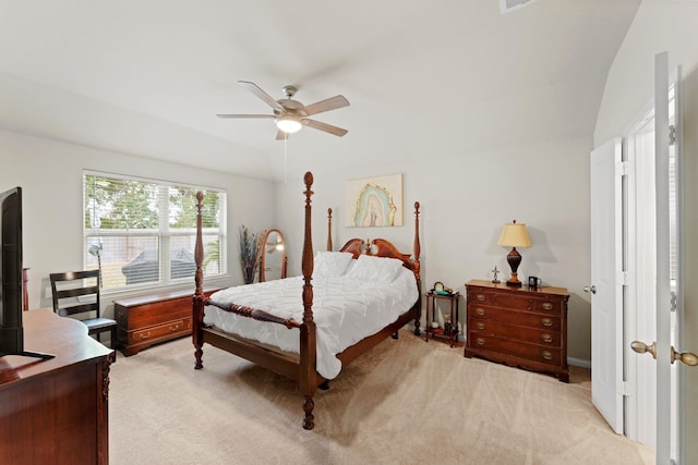 carpeted bedroom with ceiling fan and lofted ceiling