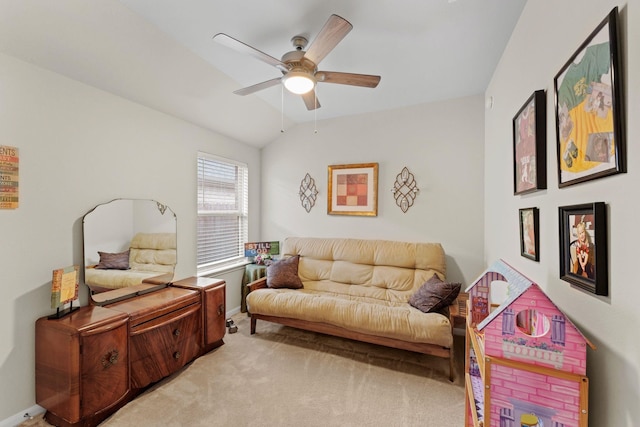 living area featuring ceiling fan, lofted ceiling, and light carpet