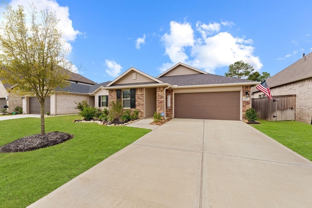 view of front of property with a garage and a front lawn