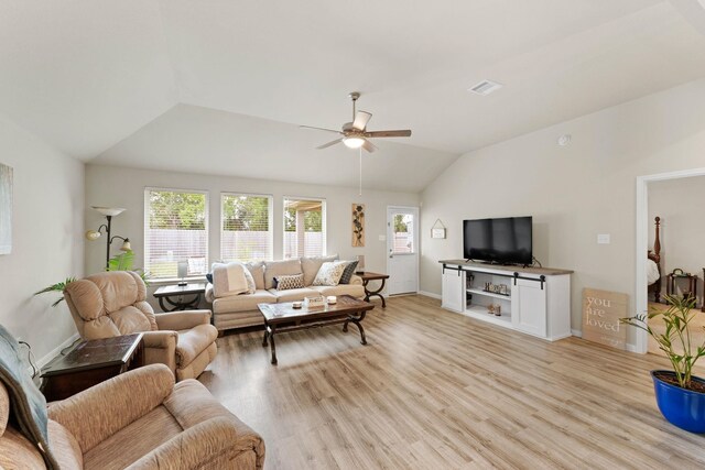 living room featuring light wood-type flooring, ceiling fan, and lofted ceiling