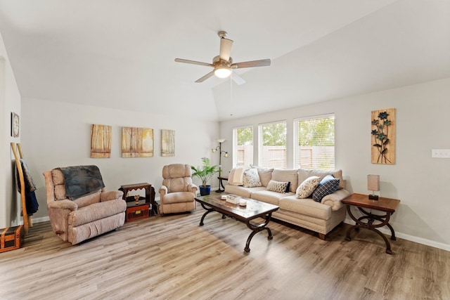 living room featuring light hardwood / wood-style floors, ceiling fan, and lofted ceiling