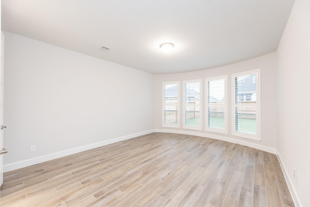 empty room featuring light hardwood / wood-style floors