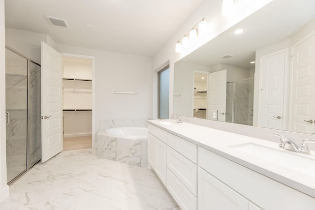 bathroom with plus walk in shower and vanity