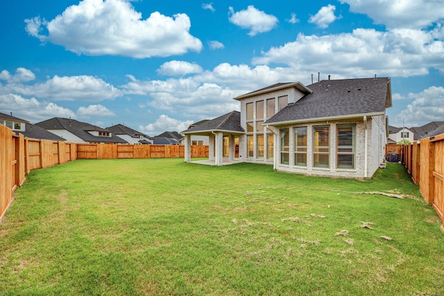 back of house featuring a yard