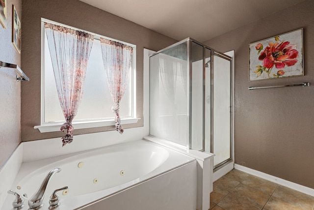 bathroom with tile patterned floors and independent shower and bath