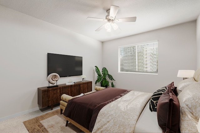 bedroom featuring ceiling fan and light carpet