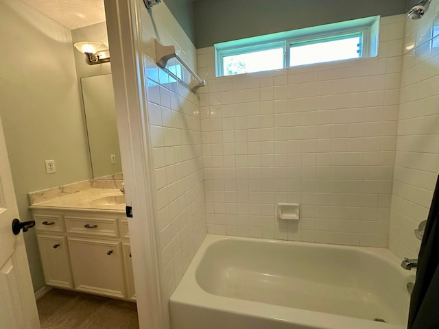 bathroom featuring vanity and shower / bath combination