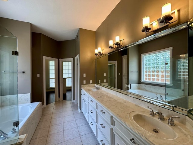 bathroom with tile patterned floors, separate shower and tub, plenty of natural light, and vanity