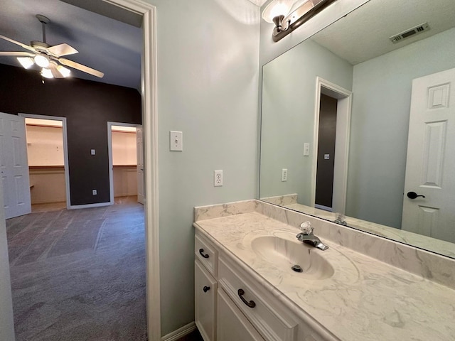 bathroom featuring ceiling fan and vanity