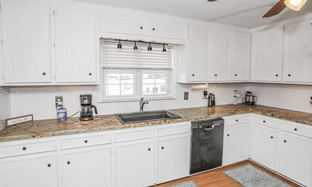 kitchen with ceiling fan, sink, stone countertops, dishwasher, and white cabinetry