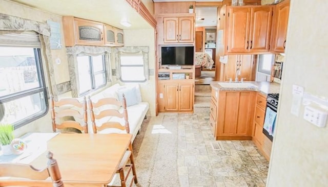 kitchen featuring stainless steel range with gas cooktop and sink