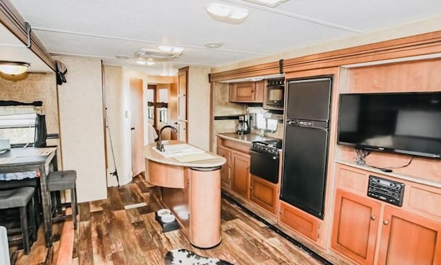 kitchen featuring dark hardwood / wood-style floors