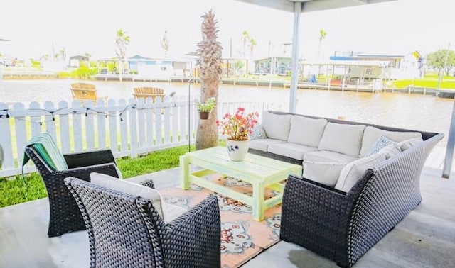 view of patio / terrace with outdoor lounge area and a water view