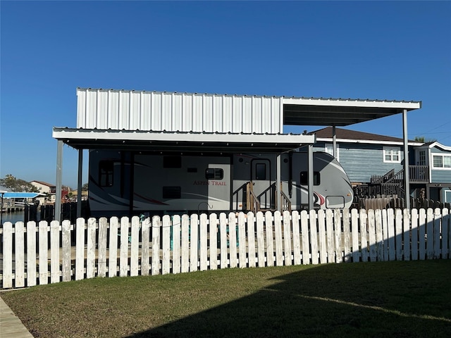 back of property featuring a lawn