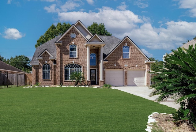 front facade with a garage and a front lawn