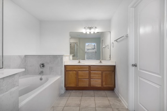 bathroom with vanity, tile patterned floors, and independent shower and bath