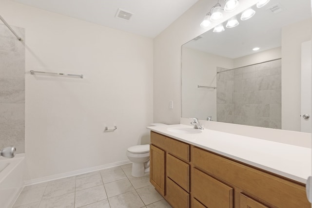 full bathroom with tile patterned floors, vanity, tiled shower / bath combo, and toilet