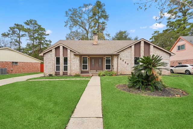 single story home with cooling unit and a front lawn