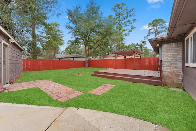 view of yard with a pergola and a wooden deck