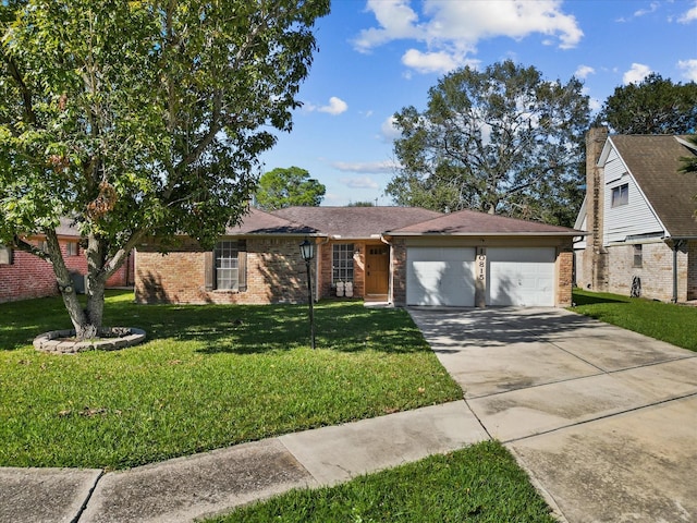 ranch-style home with a garage and a front lawn