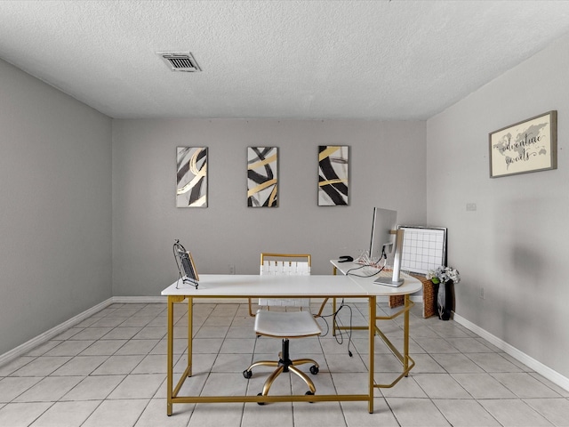 tiled office featuring a textured ceiling