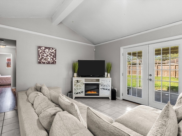 tiled living room featuring french doors, lofted ceiling with beams, and ornamental molding