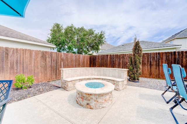 view of patio / terrace with a fire pit