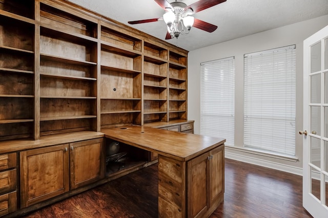 unfurnished office with french doors, dark hardwood / wood-style flooring, and ceiling fan