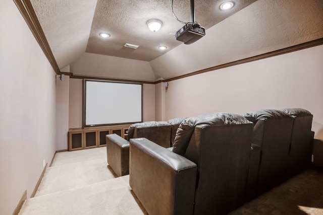 home theater room featuring crown molding, light colored carpet, a textured ceiling, and vaulted ceiling