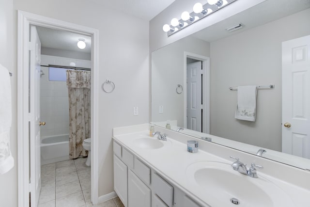 full bathroom featuring tile patterned floors, vanity, shower / tub combo, and toilet