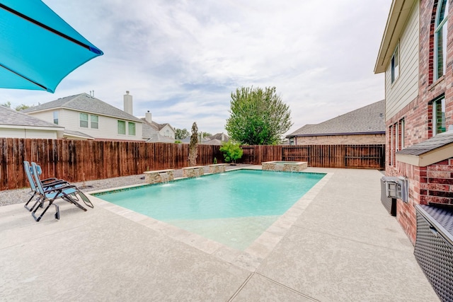 view of pool featuring pool water feature and a patio area