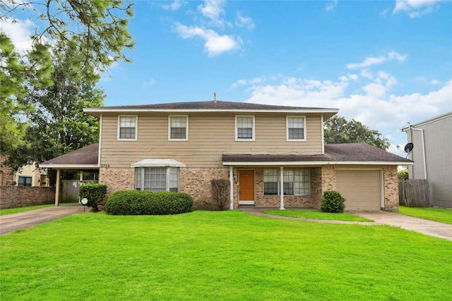 view of front of property featuring a garage and a front yard