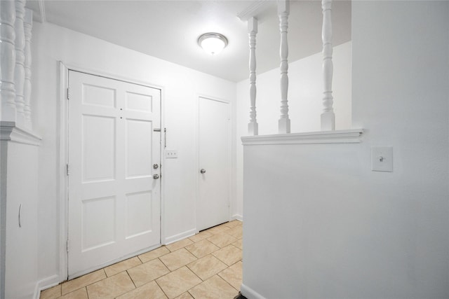 entryway with light tile patterned floors