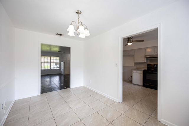 unfurnished dining area with light tile patterned floors and ceiling fan with notable chandelier