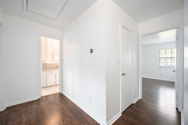 corridor featuring dark wood-type flooring