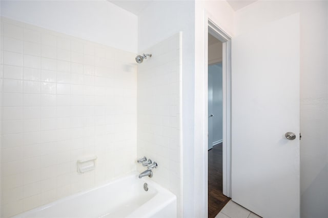 bathroom featuring bathtub / shower combination and tile patterned flooring