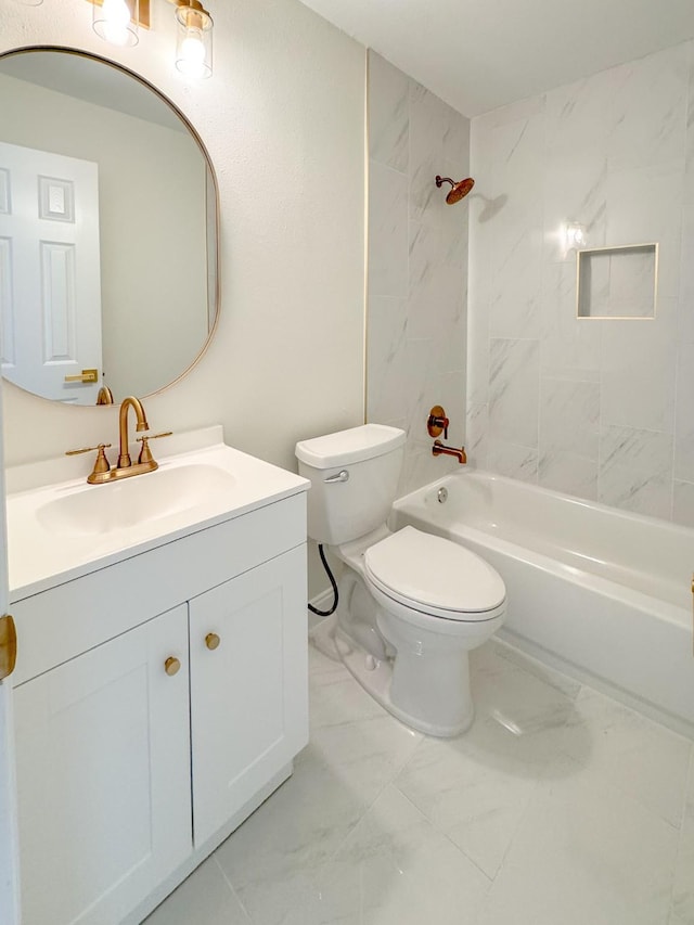 full bathroom featuring vanity, tiled shower / bath combo, and toilet