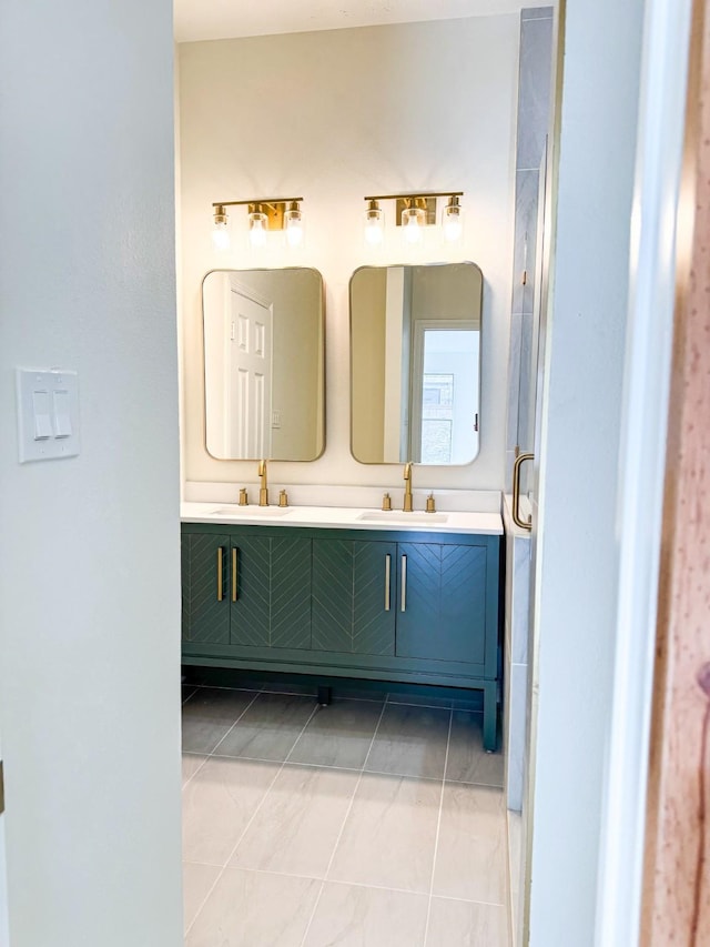 bathroom with tile patterned flooring and vanity