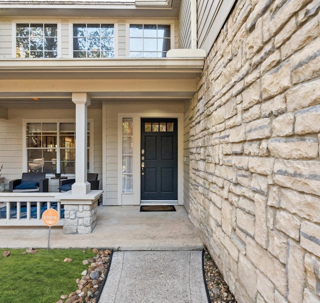 doorway to property featuring a porch